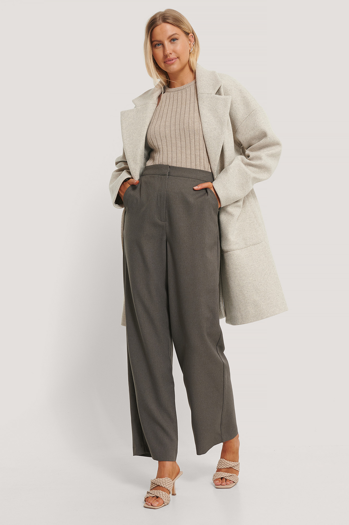 Wool Blend Dropped Shoulder Coat with Grey Suit Pants and Ribbed High Neck Knitted Sweater.