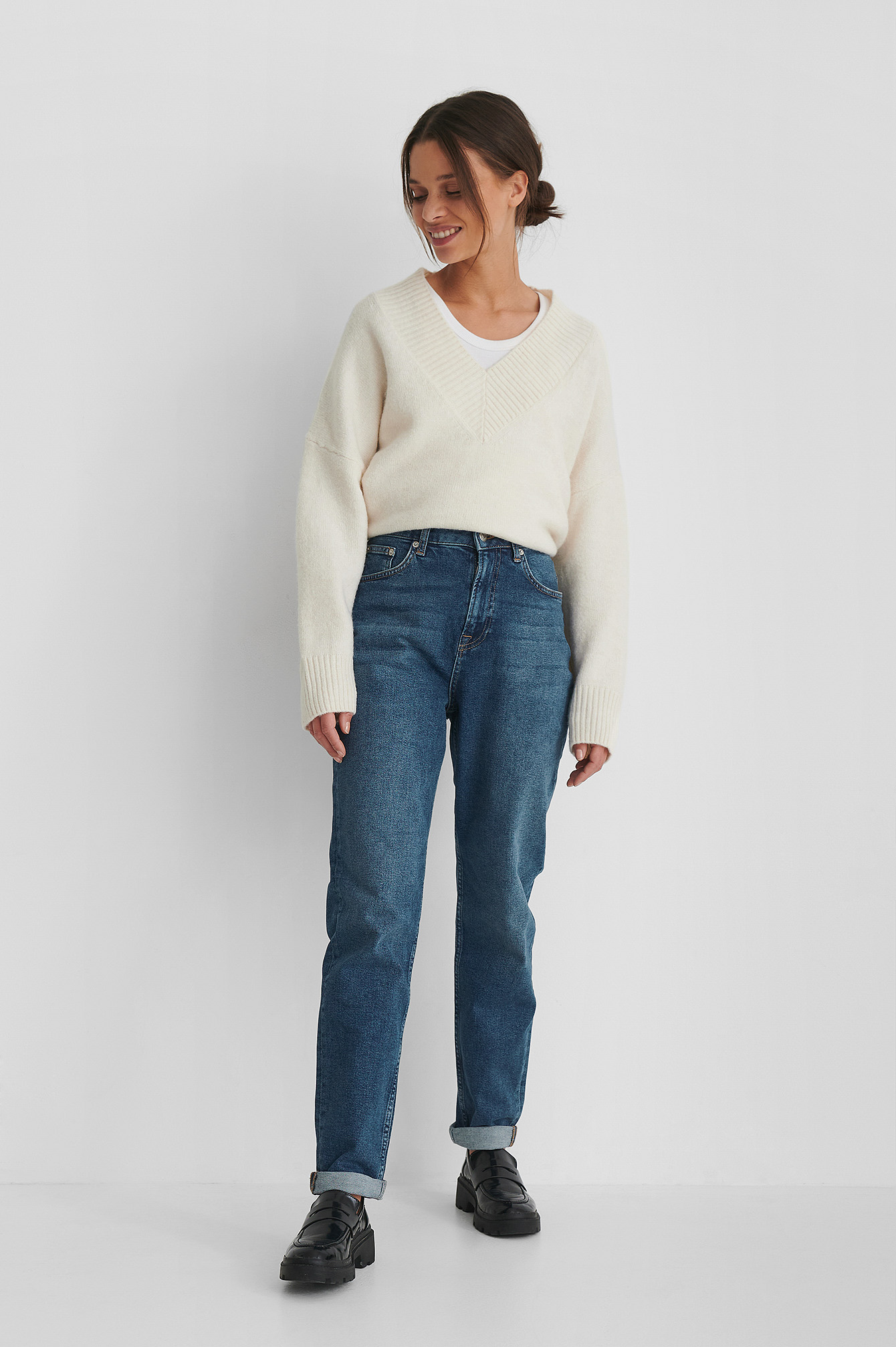 Organic Turn Up Mom Jeans with a White Knitted Sweater.